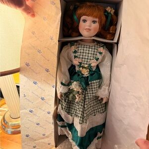 Porcelain Doll with Green Dress and Red Hair